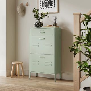 The Shoreditch shoe cabinet in sage with a top drawer, two lower shoe compartments and matching handles, styled in a hallway.