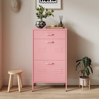 The Shoreditch shoe cabinet in flamingo with a top drawer, two lower shoe compartments and matching handles, styled in a hallway.