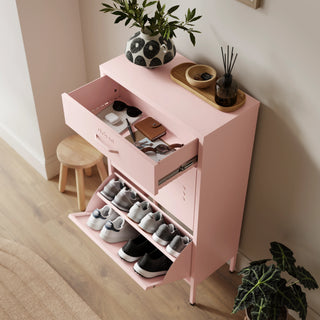 The Shoreditch shoe cabinet in pink with a top drawer, two lower shoe compartments and matching handles, styled in a hallway.
