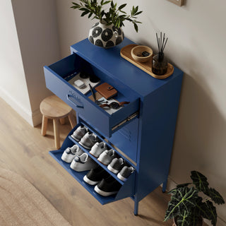 The Shoreditch shoe cabinet in navy blue with a top drawer, two lower shoe compartments and matching handles, styled in a hallway.