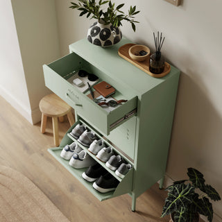 The Shoreditch shoe cabinet in sage with a top drawer, two lower shoe compartments and matching handles, styled in a hallway.