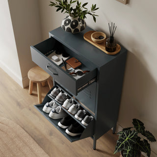 The Shoreditch shoe cabinet in grey with a top drawer, two lower shoe compartments and matching handles, styled in a hallway.