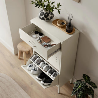 The Shoreditch shoe cabinet in Vanilla with a top drawer, two lower shoe compartments and matching handles, styled in a hallway.