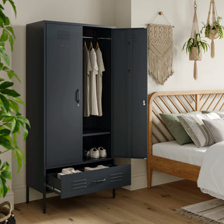 Metal, tall, double-door and single-drawer storage locker in slate grey, open showing clothes and shoes, in a bedroom